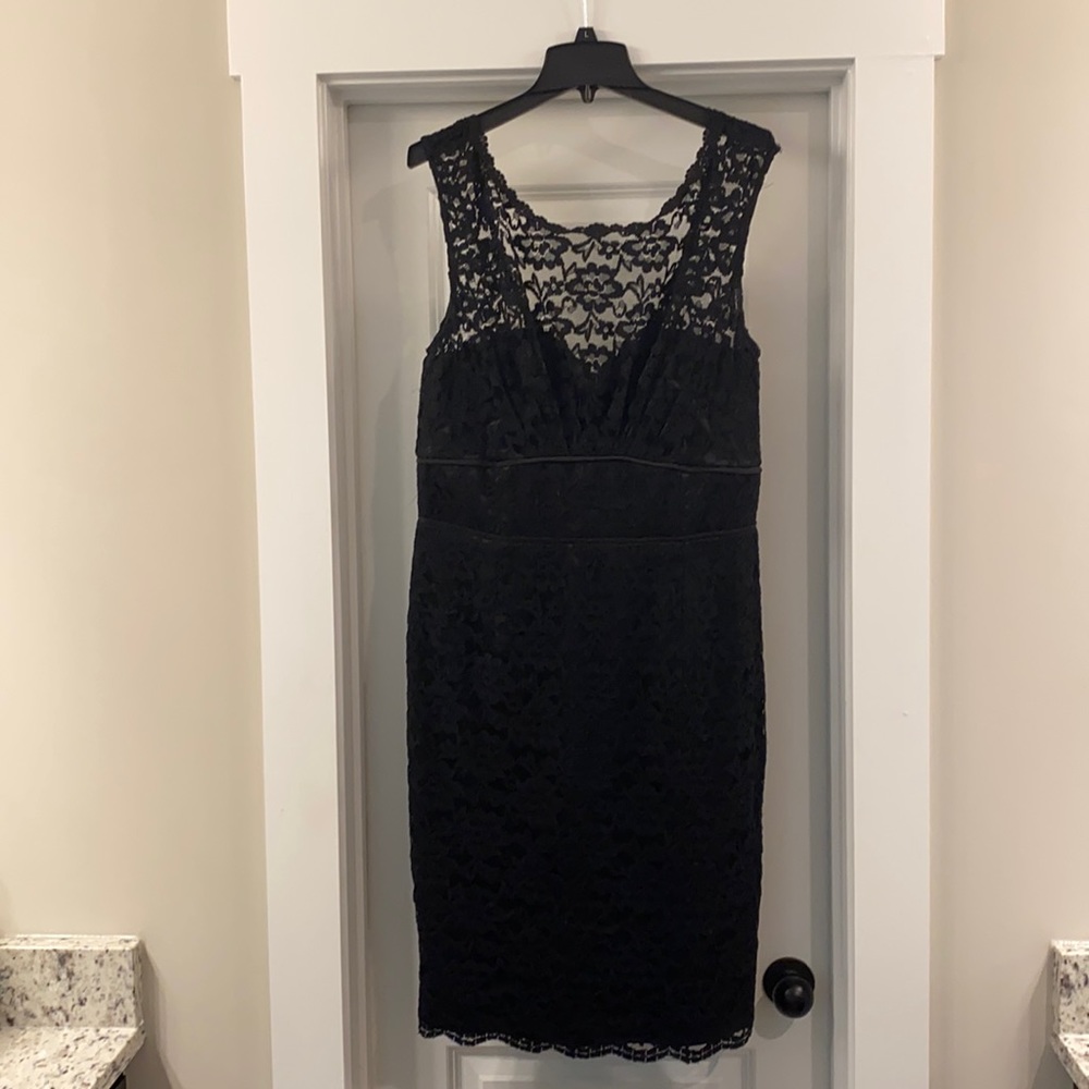 Black cocktail dress with lace overlay.